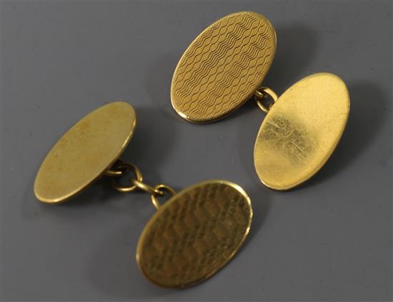 A pair of 9ct gold oval cufflinks.